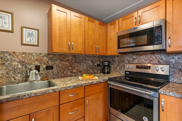 kitchen featuring tasteful backsplash, sink, and stainless steel appliances