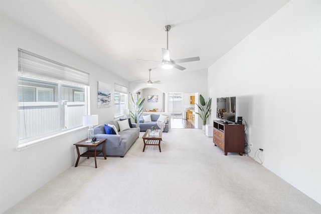 living room featuring vaulted ceiling, ceiling fan, and carpet floors