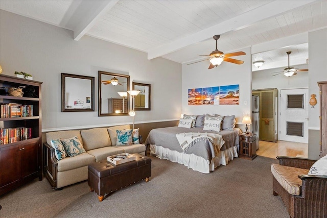 bedroom with light carpet, beam ceiling, and ceiling fan