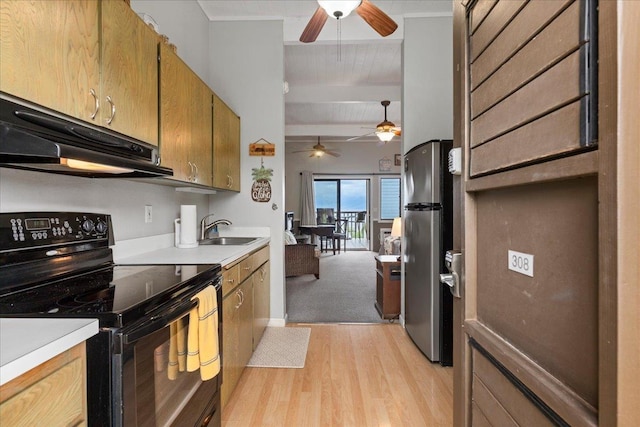 kitchen featuring sink, black electric range, stainless steel refrigerator, light colored carpet, and beam ceiling