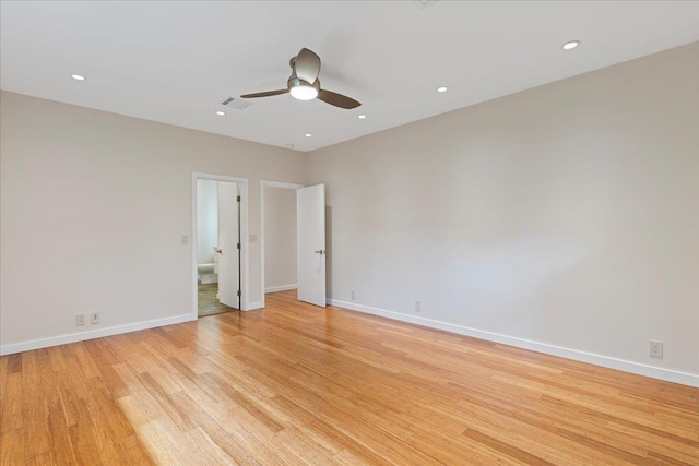 unfurnished room with baseboards, ceiling fan, and light wood finished floors