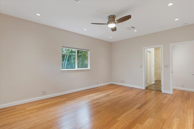empty room with light wood-type flooring, recessed lighting, baseboards, ceiling fan, and visible vents