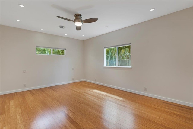 spare room featuring visible vents, baseboards, ceiling fan, recessed lighting, and light wood-type flooring