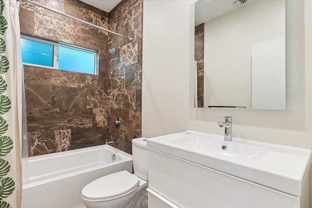 bathroom featuring shower / tub combo, visible vents, toilet, and vanity