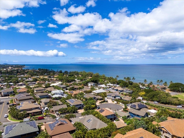 drone / aerial view with a residential view and a water view