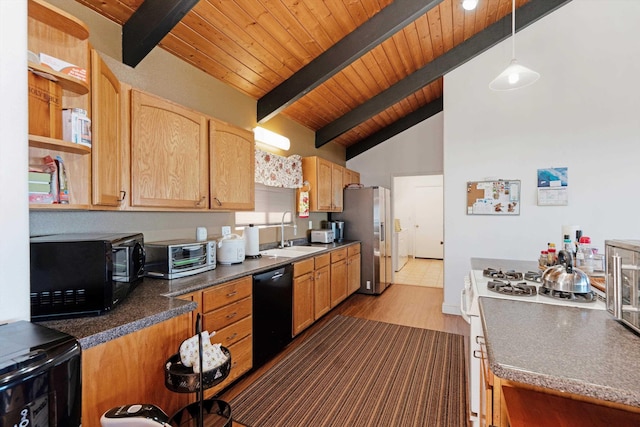 kitchen featuring sink, beamed ceiling, hardwood / wood-style floors, pendant lighting, and black appliances