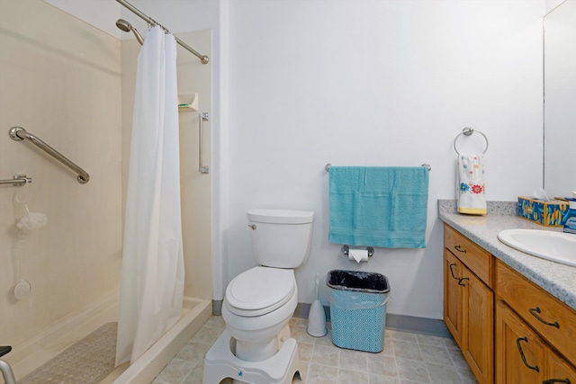 bathroom featuring vanity, toilet, and walk in shower