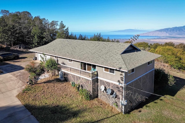 birds eye view of property featuring a mountain view