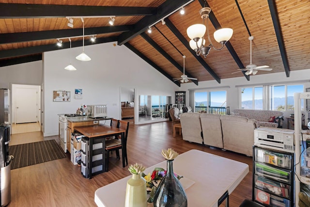 living room featuring beamed ceiling, ceiling fan with notable chandelier, wooden ceiling, and high vaulted ceiling