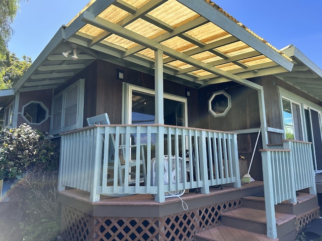 property entrance featuring a wooden deck