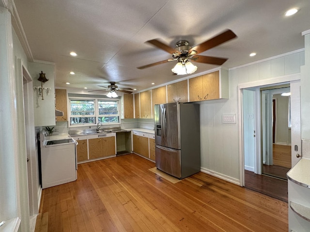 kitchen with stainless steel refrigerator with ice dispenser, white range oven, ornamental molding, light wood-type flooring, and ceiling fan