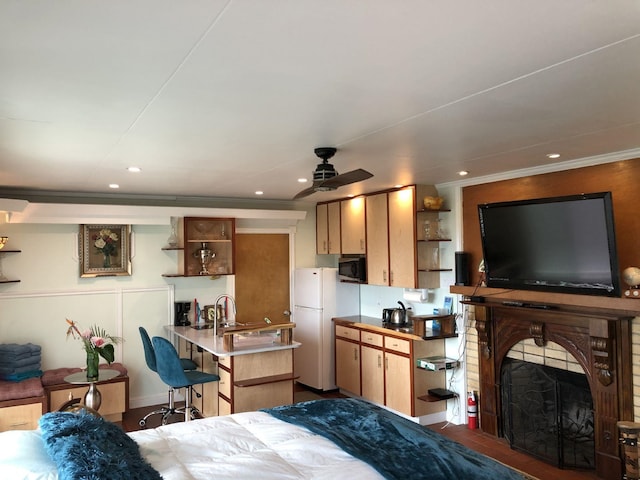 bedroom featuring crown molding, white fridge, and dark hardwood / wood-style floors