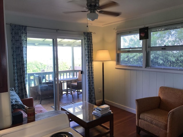 living room featuring ornamental molding, hardwood / wood-style floors, a healthy amount of sunlight, and ceiling fan