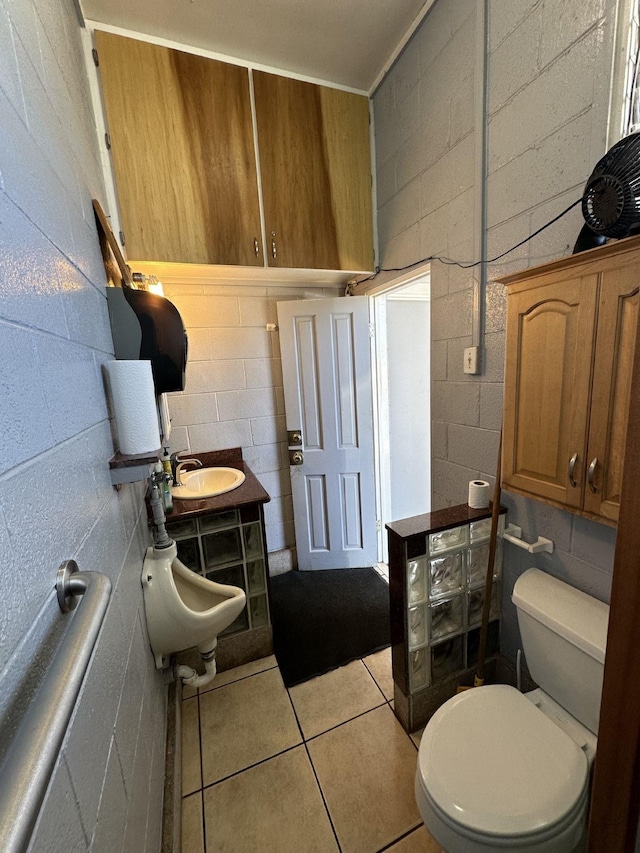 bathroom featuring tile patterned floors, sink, and toilet