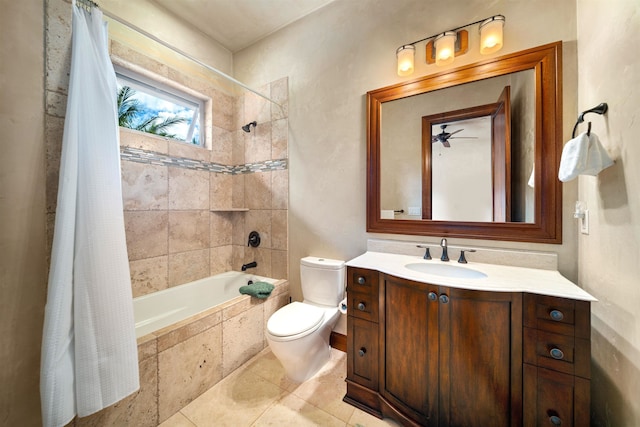 full bathroom featuring tile patterned floors, vanity, toilet, shower / tub combo with curtain, and ceiling fan