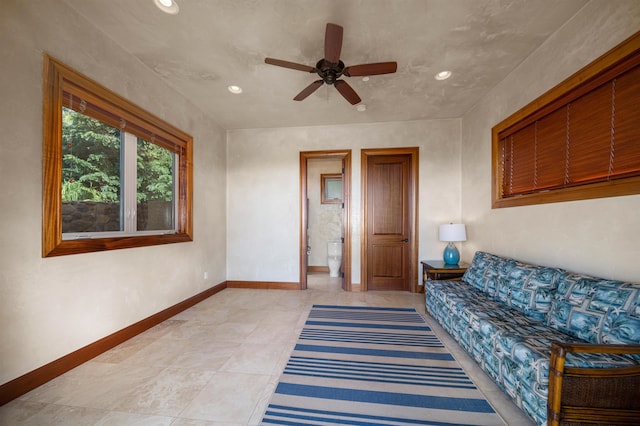 living area with ceiling fan