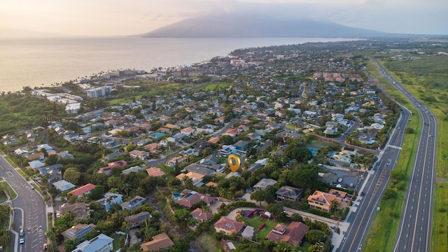 birds eye view of property with a residential view and a water view