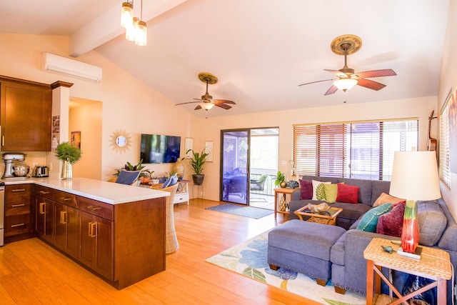 kitchen with light countertops, a wall mounted AC, open floor plan, plenty of natural light, and a peninsula