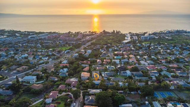 aerial view at dusk with a water view