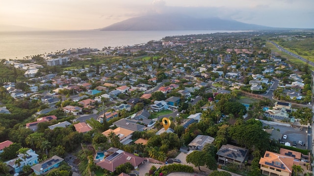 drone / aerial view with a water view and a residential view