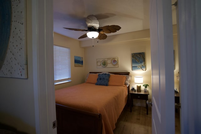 bedroom featuring a ceiling fan and wood finished floors