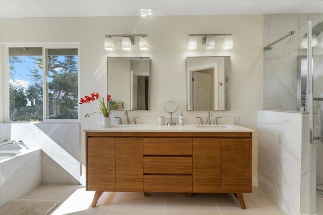 full bath with double vanity, a garden tub, a sink, and a marble finish shower