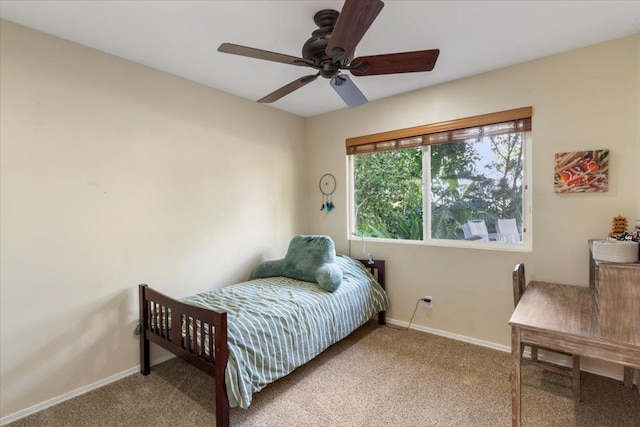 bedroom featuring a ceiling fan, carpet floors, and baseboards