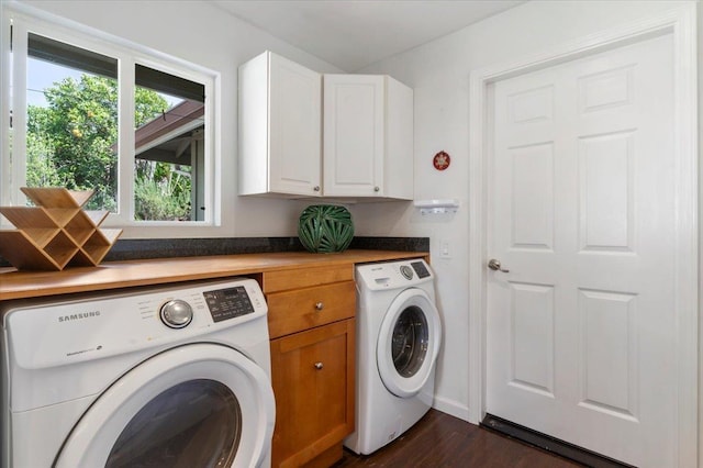 laundry room with washer and dryer, cabinet space, and dark wood-type flooring