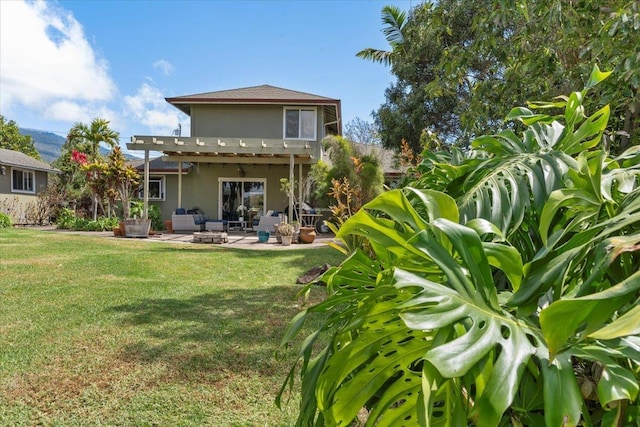 back of house with an outdoor living space, stucco siding, a pergola, a patio, and a yard