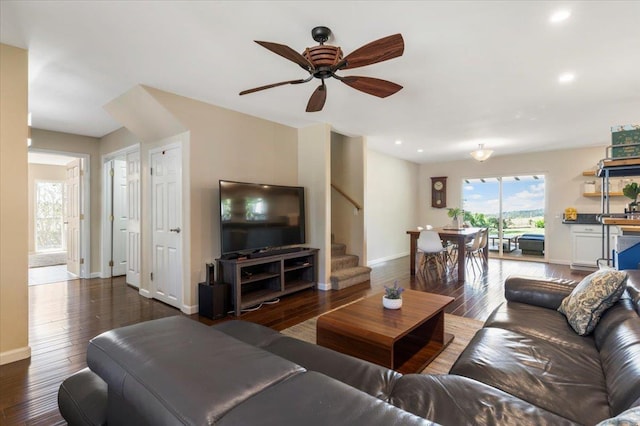 living area featuring stairway, recessed lighting, wood-type flooring, baseboards, and ceiling fan