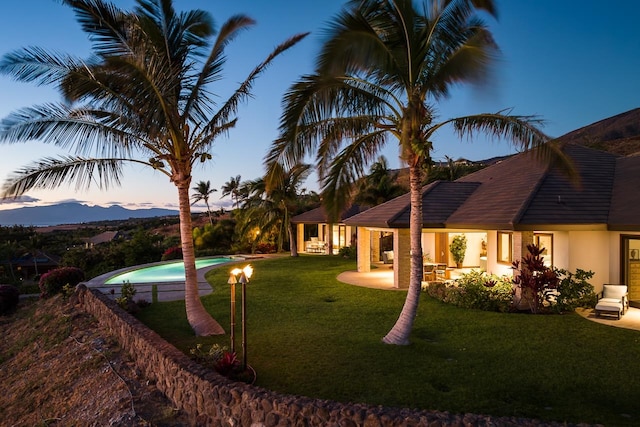 exterior space featuring a fenced in pool and a patio area