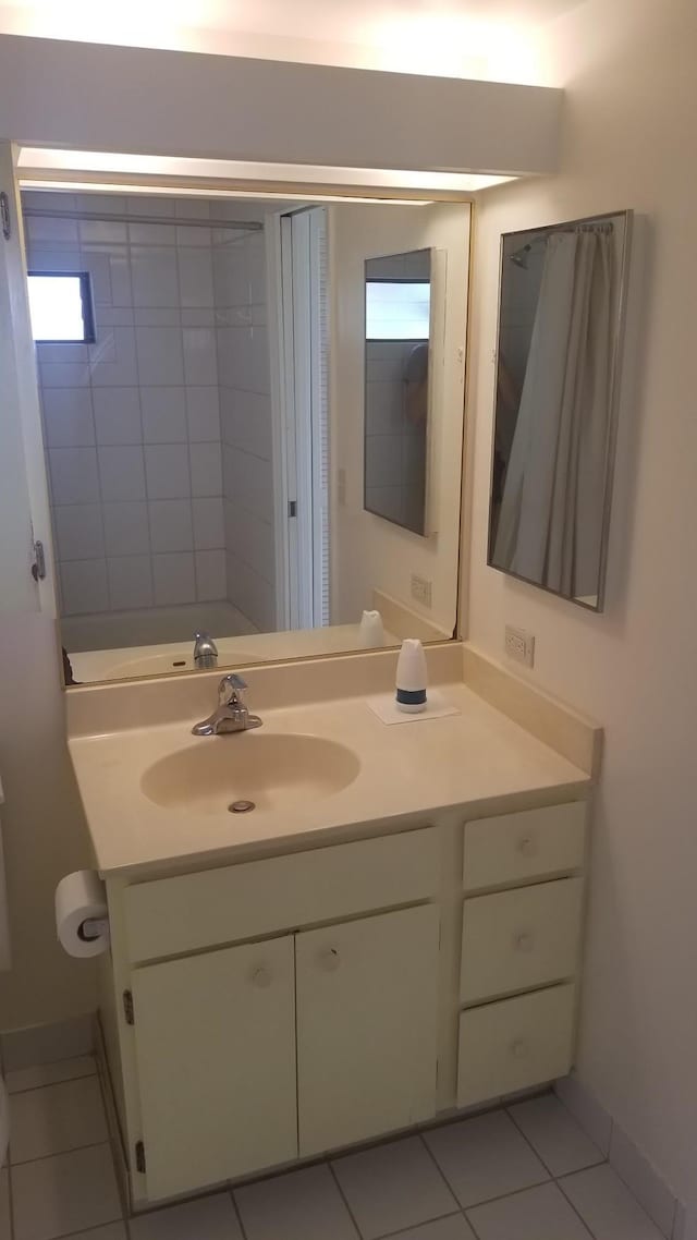 bathroom featuring tile patterned floors and vanity