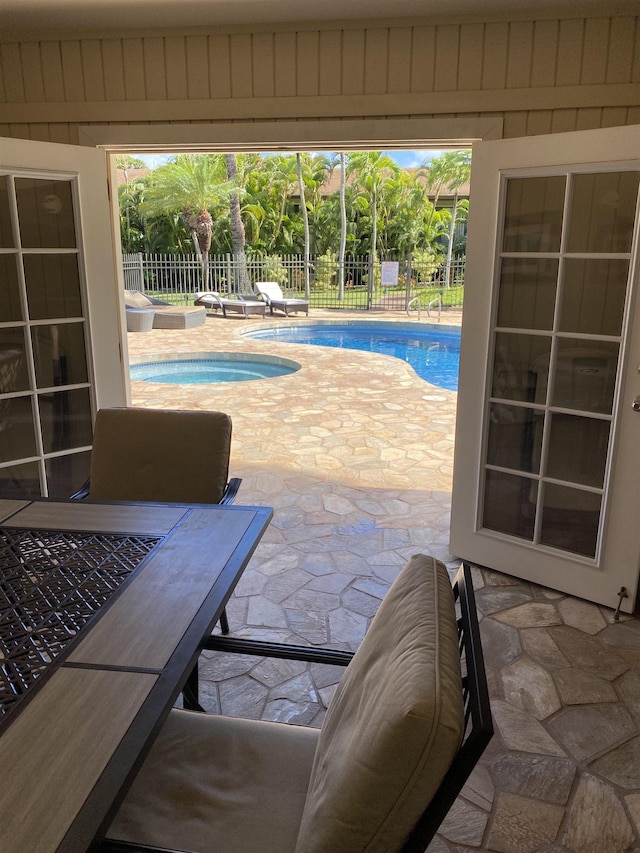 view of pool featuring an in ground hot tub, a patio, and a diving board