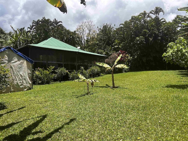 view of yard with a sunroom