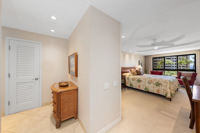 tiled bedroom featuring a closet and ceiling fan