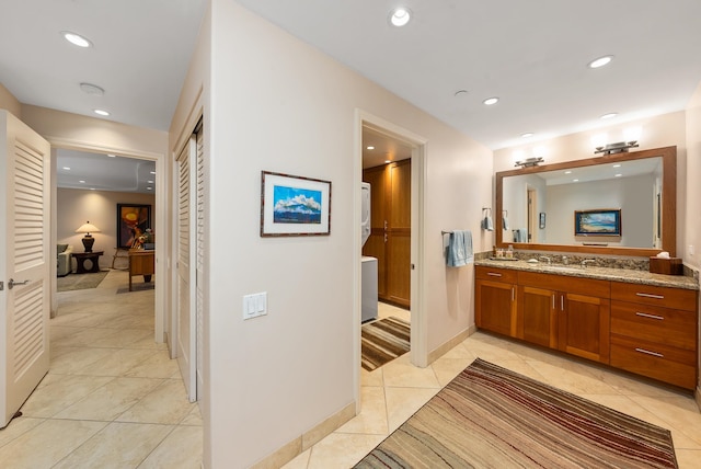 bathroom with tile flooring and vanity