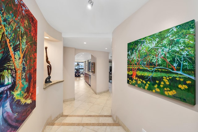 hallway with tile floors