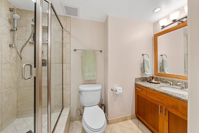 bathroom featuring a shower with shower door, toilet, and vanity