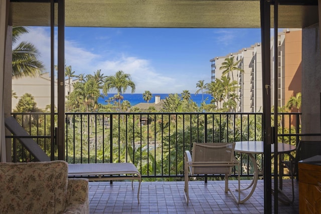 balcony featuring a water view