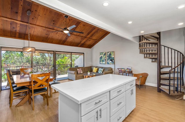 811 S Kihei Rd Unit 2H, Kihei, HI 96753 - kitchen featuring light wood finished floors, white cabinets, recessed lighting, a kitchen island, and a ceiling fan
