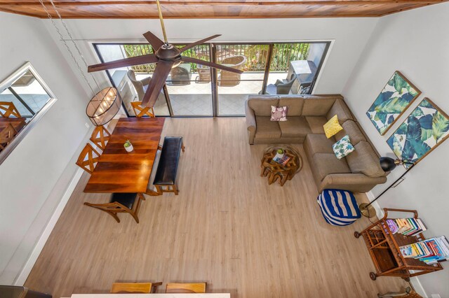 811 S Kihei Rd Unit 2H, Kihei, HI 96753 - living area with wood finished floors, healthy amount of natural light, wood ceiling, and a ceiling fan