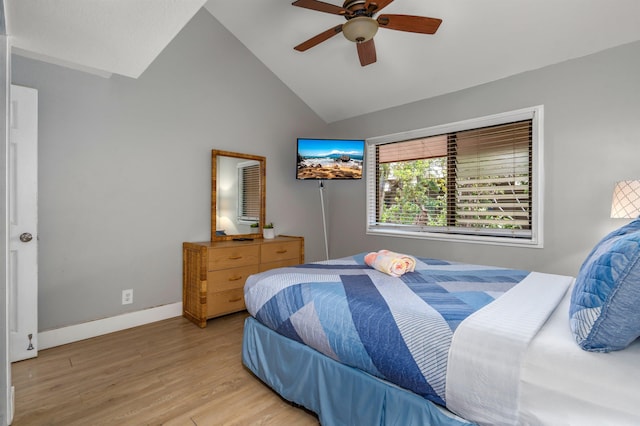 811 S Kihei Rd Unit 2H, Kihei, HI 96753 - bedroom with light wood-type flooring, vaulted ceiling, baseboards, and ceiling fan