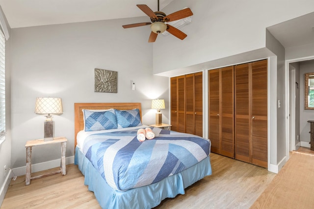 811 S Kihei Rd Unit 2H, Kihei, HI 96753 - bedroom with two closets, wood finished floors, baseboards, and a high ceiling