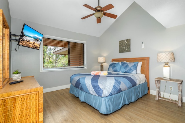 811 S Kihei Rd Unit 2H, Kihei, HI 96753 - bedroom featuring baseboards, wood finished floors, and high vaulted ceiling