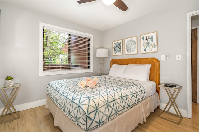 811 S Kihei Rd Unit 2H, Kihei, HI 96753 - bedroom featuring wood finished floors, baseboards, and ceiling fan
