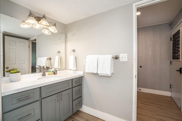 811 S Kihei Rd Unit 2H, Kihei, HI 96753 - bathroom with wood finished floors, vanity, and baseboards