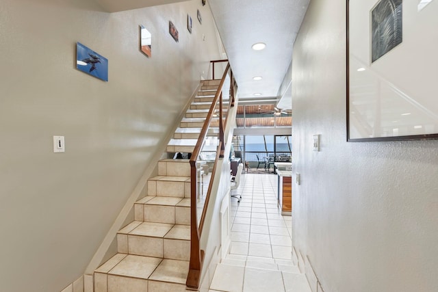 stairs featuring tile patterned flooring