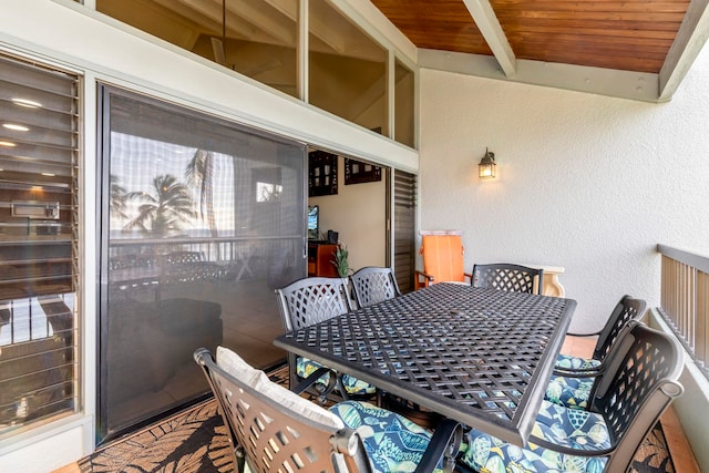 dining space with vaulted ceiling with beams and wood ceiling