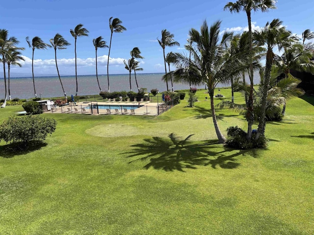 1000 Kam V Hwy Unit 320B, Kaunakakai, HI 96748 - view of community featuring a water view, a swimming pool, and a yard