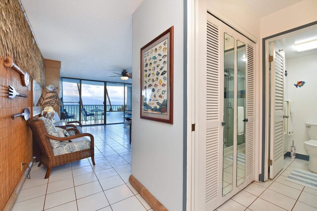 4327 Lower Honoapiilani Rd Unit 207B, Lahaina, HI 96761 - corridor with light tile patterned floors and a wall of windows